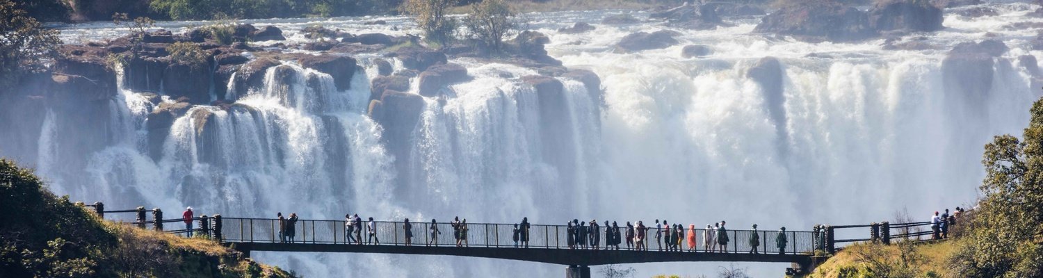 Walk along Knife Edge Bridge on the Zambian side.